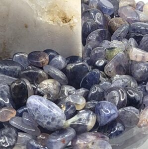 Colorful gemstones and rustic decor from Mayhem Canyon Mineral Co, showcasing unique southwestern styles.
